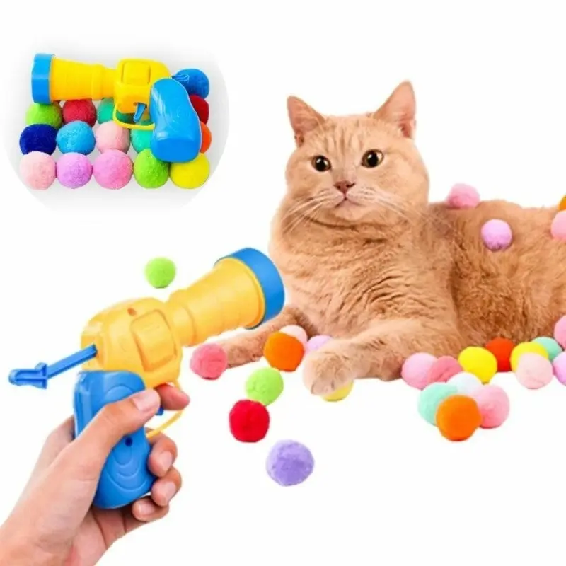 Cat playing with ball launcher